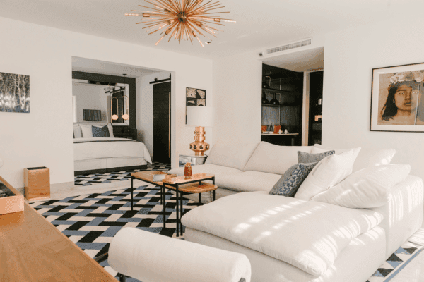 Owner’s Suite A with grand living room, balcony, and Casa Armida design