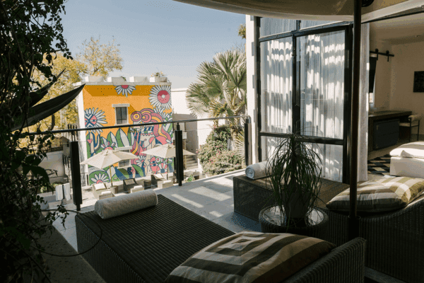 Owner’s Suite A with grand living room, balcony, and Casa Armida design